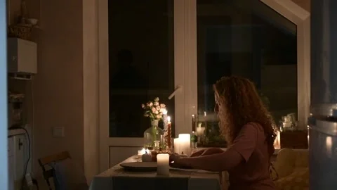 Young couple setting cutlery on the table while preparing for a dinner 库存影片 330804509
