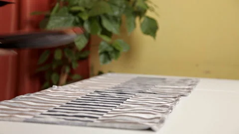 Young couple setting the table, getting ready for dinner Stock Footage 104325788