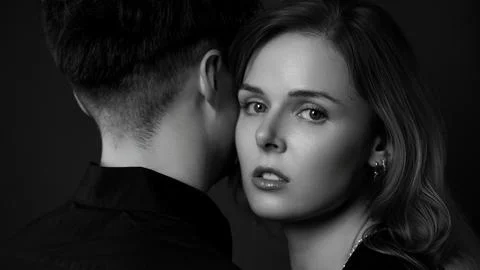 Young couple sharing secrets, close intimate moment Stock Photos