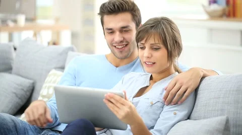 Young couple shopping on internet with tablet Stock Footage 44112352