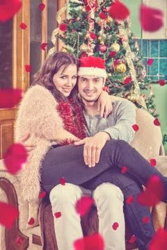 Young Couple Sitting in Chair in Their Home Stock Photos