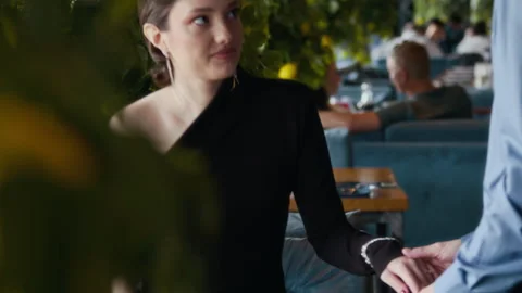 Young Couple Sitting down at Restaurant Table during Dinner Stock Footage 312672867