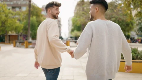 Young couple smiling confident hugging each other at park Video stock 171787555
