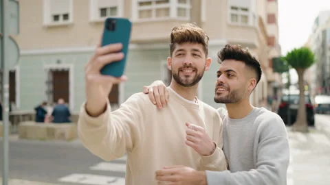 Young couple smiling confident make selfie by the smartphone at street Video stock 171787575