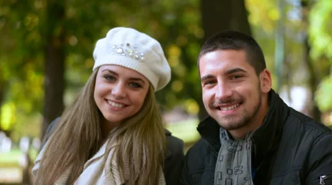 Young couple smiling in park Stock Footage