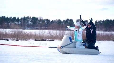 Young couple on snowmobile Stock Footage 61219900