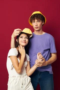A young couple stand side by side fashion modern style home fun isolated Fotos Stock