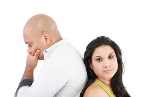 Young couple standing back to back having relationship difficulties on white Stock Photos