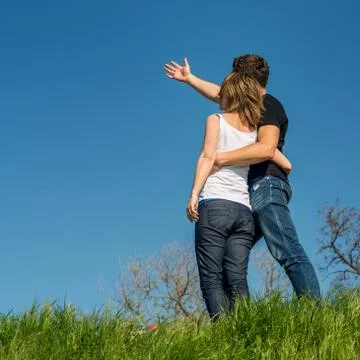 Young couple standing on a beach Stock Photos