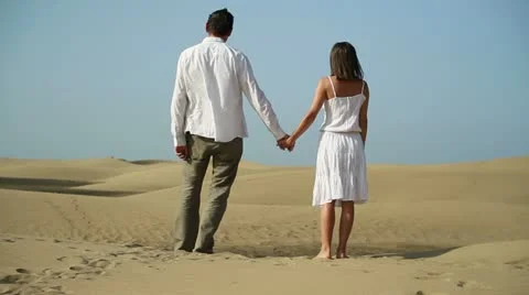 Young couple standing in the desert HD Stock Footage