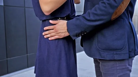 Young couple  standing in front of modern building. Romantic meeting Stock Footage 55895398