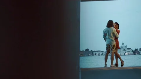 Young Couple Standing On The Platform. View On The Evening Of Venice. Stock Footage 106086038