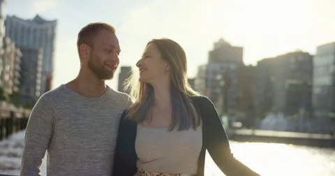 Young couple standing side-by-side and smiling Stock Footage 79403305