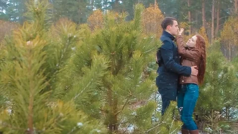 Young Couple Standing in Winter Forest Video stock 71565917