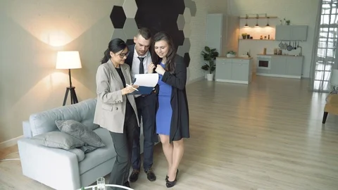 Young couple studying contract terms before signing. Stock Footage 119346251