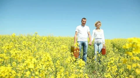 Young couple with suitcases Stock Footage 11128620