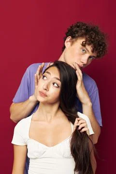A young couple summer style posing fashion emotions isolated background Stock Photos