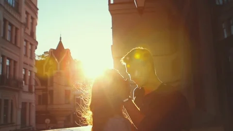 Young Couple On The Sunset Background Stockbeeldmateriaal 75162699