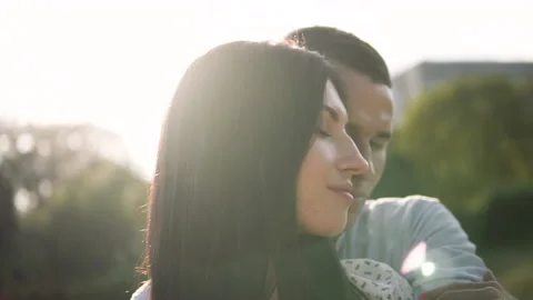 Young couple on a sunset background hugging Stock Footage 145979743