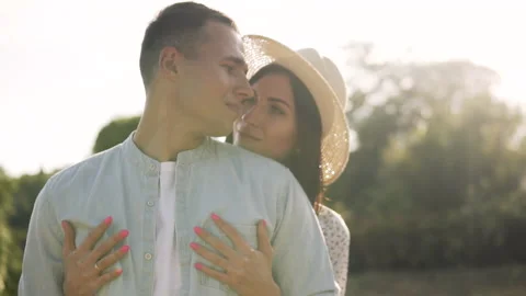 Young couple on a sunset background hugging Stock Footage 145985842