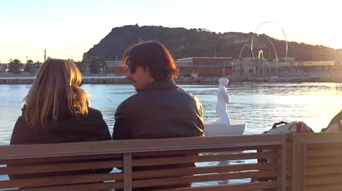 Young couple at sunset by the water Stock-Footage 35624897