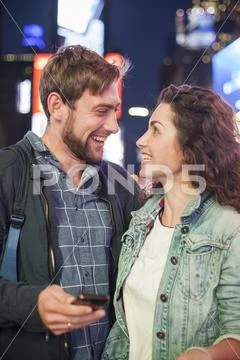 Young couple surprised by good news Stock Photos