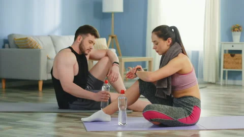 Young Couple Takes a Pause after Workout Stock Footage 132016380