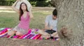 young couple takes a picnic to the park and drinking wine HD Footage