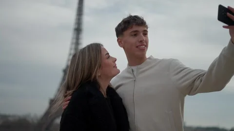 Young couple taking selfie with Eiffel Tower in Paris France Romantic vacation Stock Footage 325267328