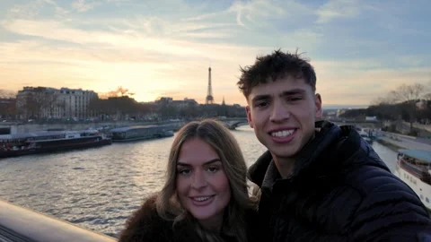 Young Couple Taking Selfie with Eiffel Tower in Paris at Sunset Candid Moment Stock Footage 328108164
