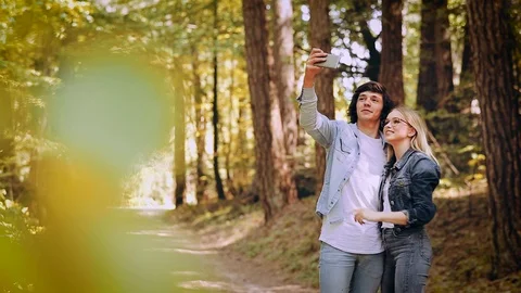 Young Couple Taking Selfie On A Forest Walking Stock Footage 89893782
