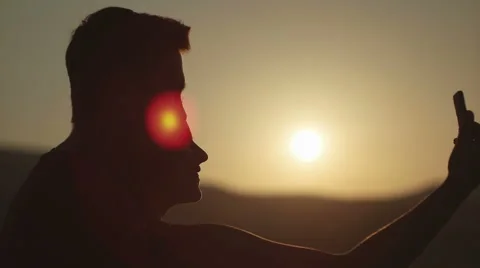 Young couple taking selfie at sunset in slow motion Stock Footage 53664073