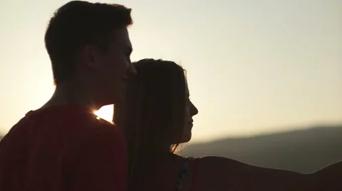 Young couple taking selfie at sunset in slow motion Stock Footage 53664461