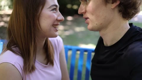 Young couple talk and discover mutual attraction during an outdoor date Видео 342267951