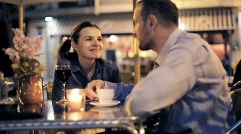 Young couple talking and drinking wine and coffee in cafe HD Stock Footage 33144204