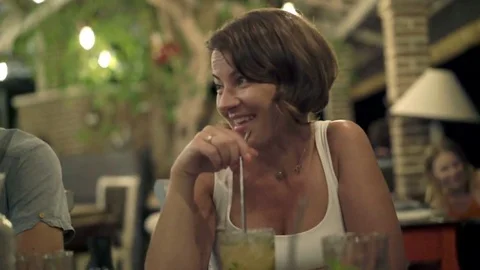 Young couple talking and drinking coffee in cafe, 4K Video stock 69181003