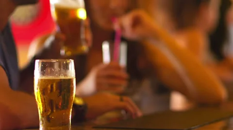 A young couple talking at a bar and having a drink Video stock 33847548