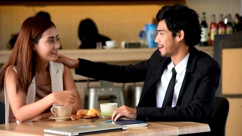 Young couple talking in cafe coffee shop happy date couple communication positiv Видео 124308979