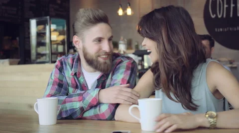 Young couple talking at cafe Stock Footage 64654632