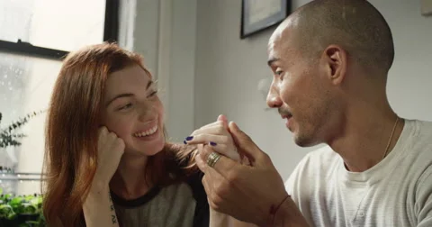 Young couple talking to each other at breakfast table Vídeo Stock 63374728