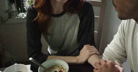 Young couple talking while having breakfast at home Vídeo Stock 63374708