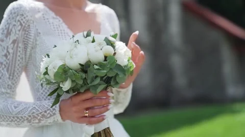 Young Couple On Their Wedding Day. Groom Approaches The Bride near the castle Stock Footage 243317820
