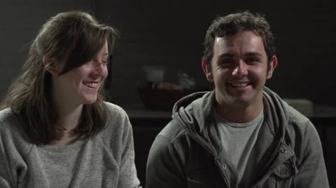Young couple at a therapy session, laughing Stock Footage