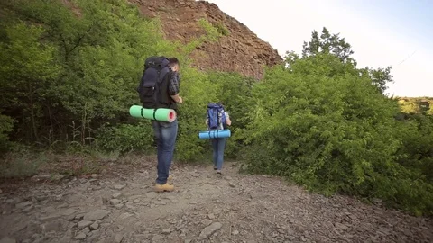 Young couple traveling with backpacks. Stock Footage