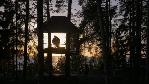 Young Couple In Tree House At Sunset Near The Sea Video stock 93236772