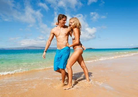 Young couple on tropical beach Stock Photos