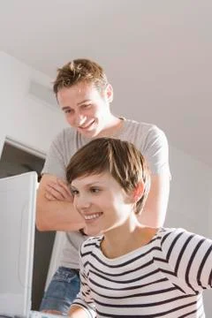 Young Couple using Computer, Miami Beach, Florida, USA Stock Photos
