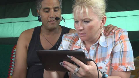 Young couple using digital electronic tablet computer business smile man woman Stock Footage 27966321