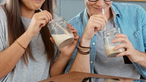 Young couple using digital tablet computer in cafe. Video stock 199634376