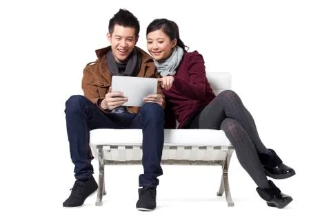 Young couple using digital tablet Stock Photos